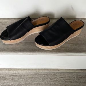 Coclico Ana black leather slides.  Lightweight wooden platform. 2” heel Size 39.